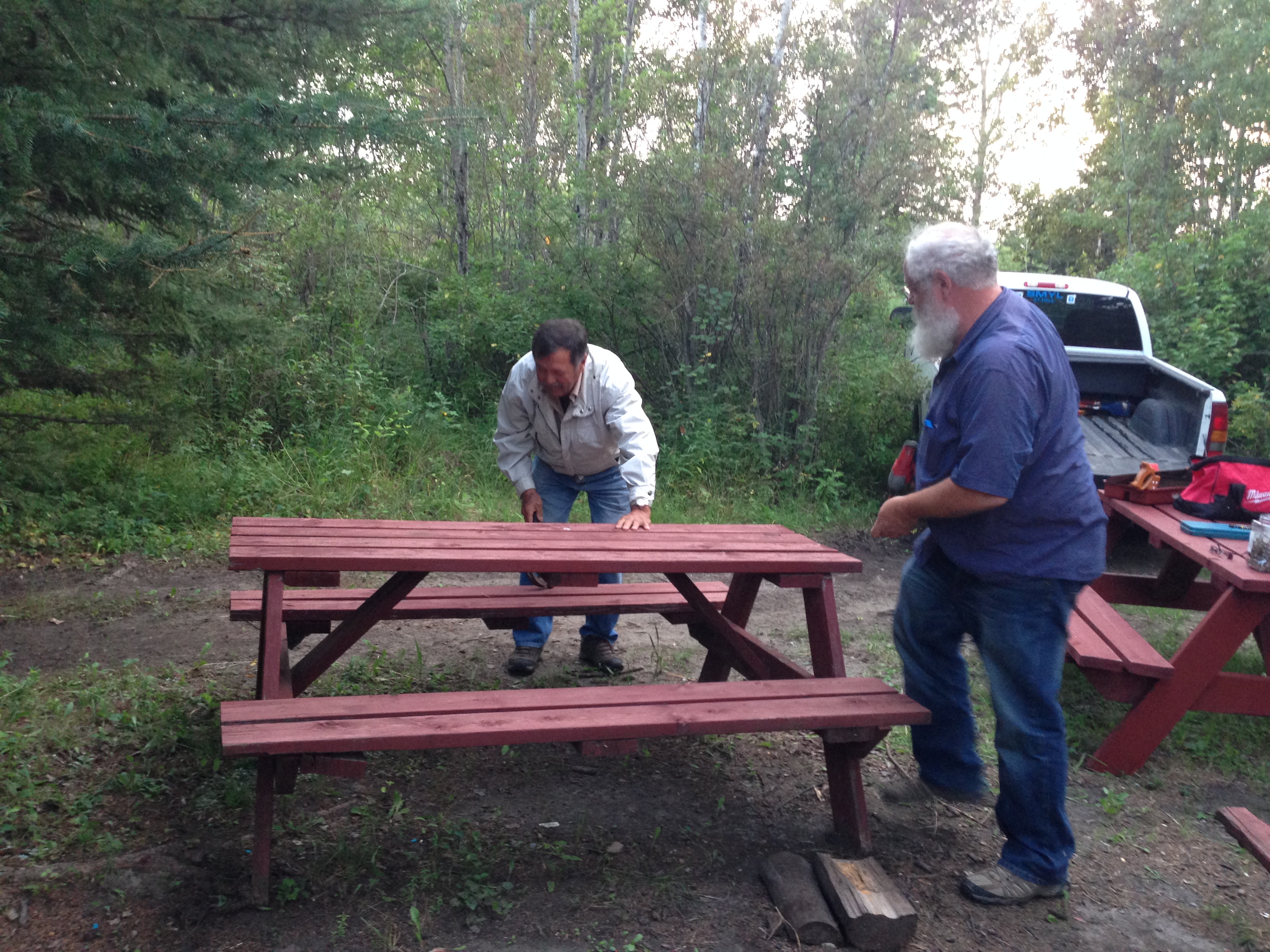 Volunteers%20repairing%20picnic%20tables.JPG